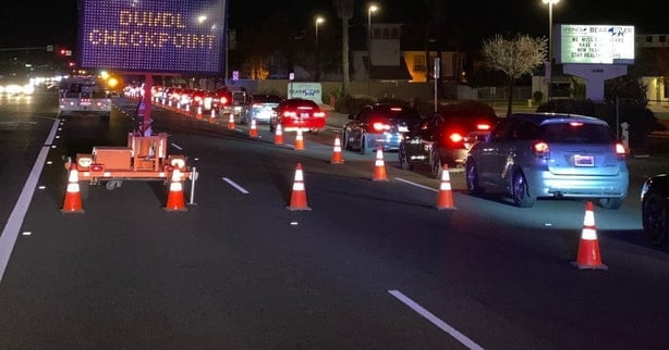DUI checkpoint by police during traffic.